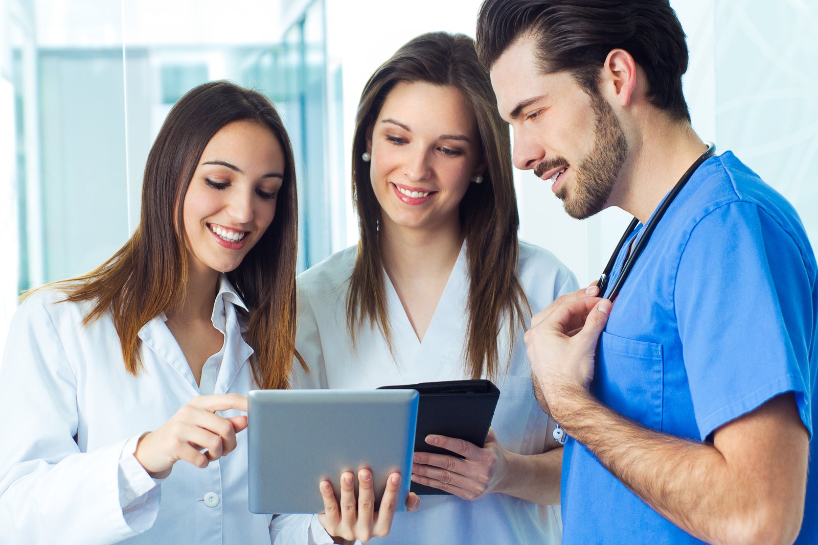Clinical staff along a hospital corridor